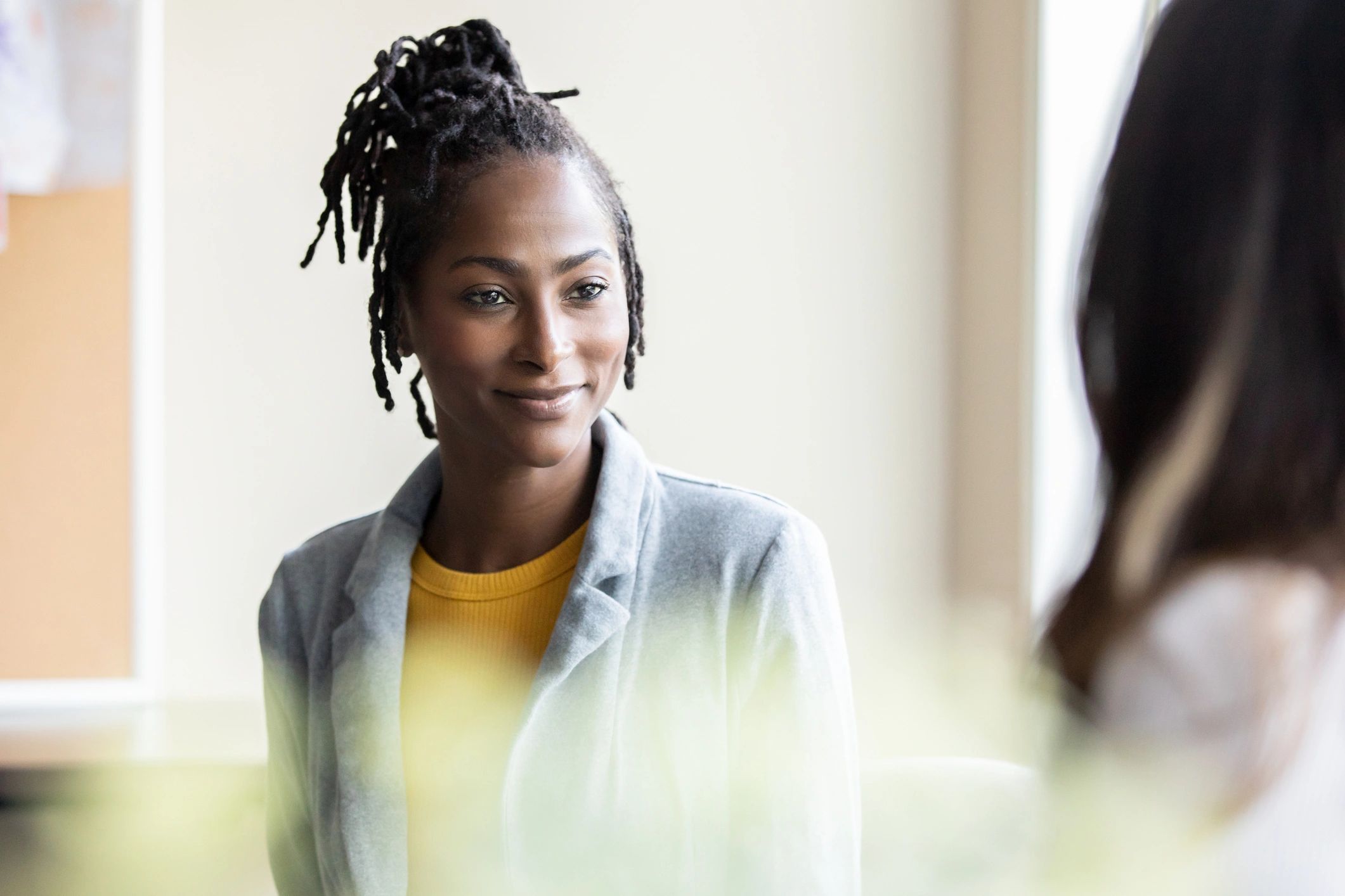 Mental health counselor meeting with a teenage client