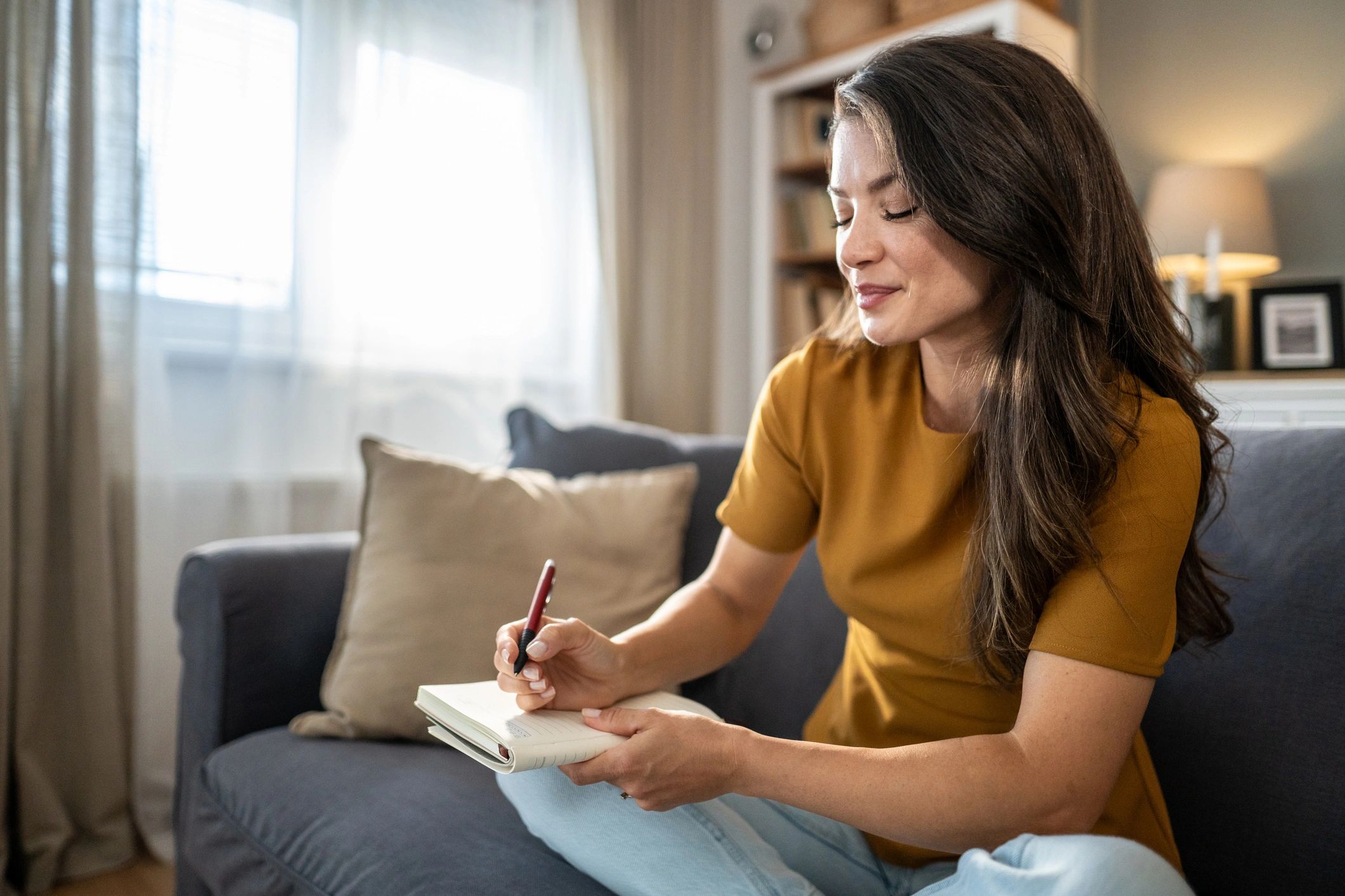 Woman journaling for self-reflection and mental wellness